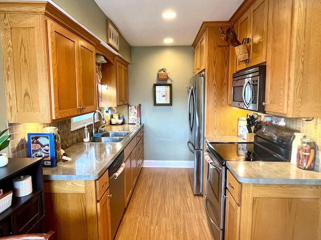 8412 4th Ave S, Bloomington, MN 55420 - kitchen featuring appliances with stainless steel finishes, tasteful backsplash, brown cabinetry, light wood-style flooring, and recessed lighting