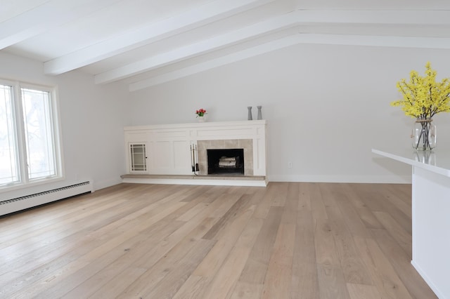 2611 Kyle Ave N, Golden Valley, MN 55422 - unfurnished living room with light wood-style floors, a tile fireplace, and a baseboard heating unit