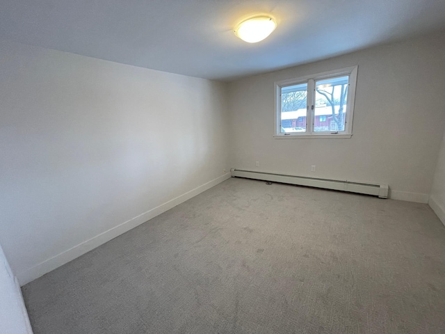2611 Kyle Ave N, Golden Valley, MN 55422 - empty room with baseboard heating and light colored carpet