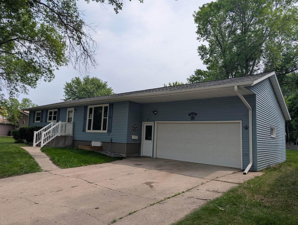 507 1st St, Marshall, MN 56258 - ranch-style home featuring a garage and concrete driveway