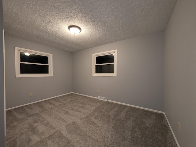 507 1st St, Marshall, MN 56258 - empty room featuring carpet and a textured ceiling