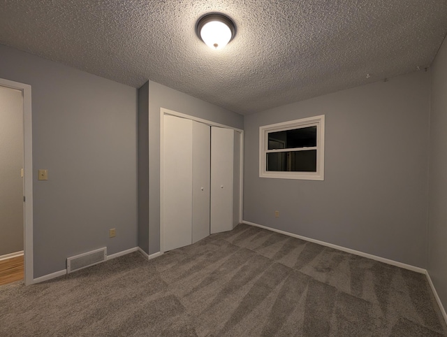 507 1st St, Marshall, MN 56258 - unfurnished bedroom with carpet floors, a closet, and a textured ceiling