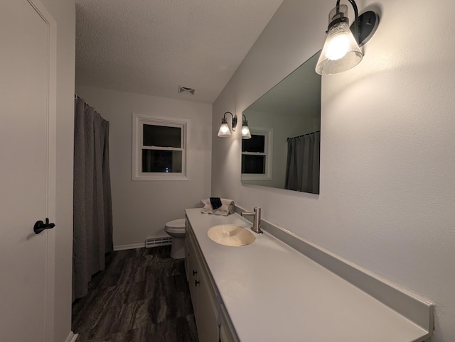 507 1st St, Marshall, MN 56258 - full bathroom featuring vanity, a textured ceiling, and a shower with shower curtain