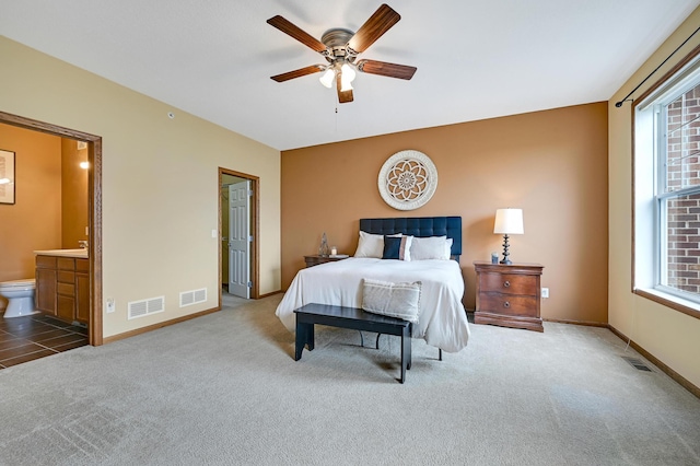 16618 72nd Ct NE, Otsego, MN 55330 - carpeted bedroom featuring ensuite bathroom and ceiling fan