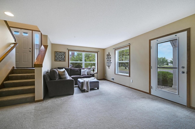16618 72nd Ct NE, Otsego, MN 55330 - carpeted living room with stairway and a textured ceiling