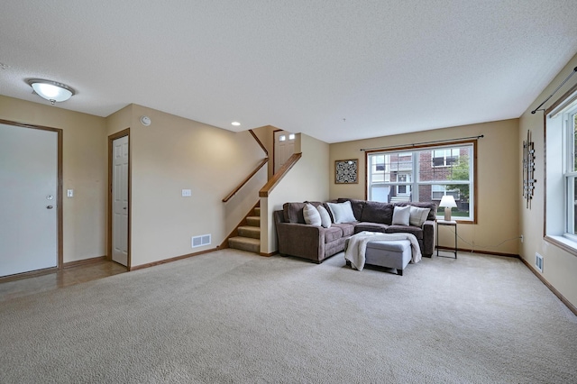 16618 72nd Ct NE, Otsego, MN 55330 - carpeted living room featuring a textured ceiling and stairs