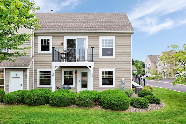 16618 72nd Ct NE, Otsego, MN 55330 - back of property with a balcony, a yard, and a shingled roof