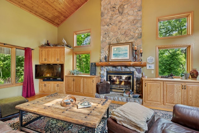 940 Brown Rd S, Wayzata, MN 55391 - living area featuring high vaulted ceiling, a stone fireplace, wood ceiling, and wood finished floors