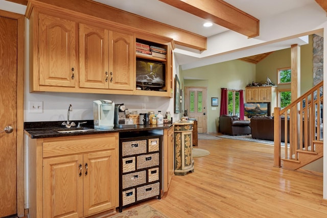 940 Brown Rd S, Wayzata, MN 55391 - indoor wet bar with light wood-type flooring and stairs