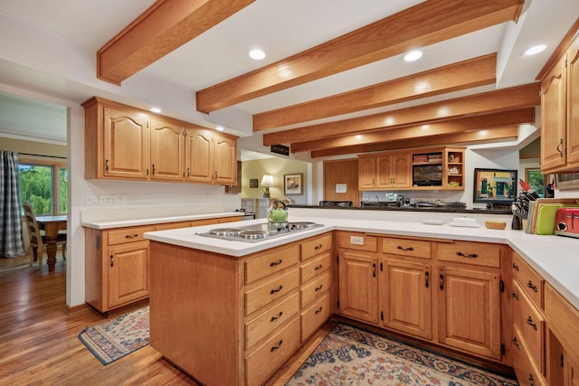 940 Brown Rd S, Wayzata, MN 55391 - kitchen with stainless steel electric stovetop, light countertops, recessed lighting, beamed ceiling, and light wood-style floors