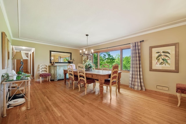 940 Brown Rd S, Wayzata, MN 55391 - dining area featuring a chandelier, light wood finished floors, and crown molding
