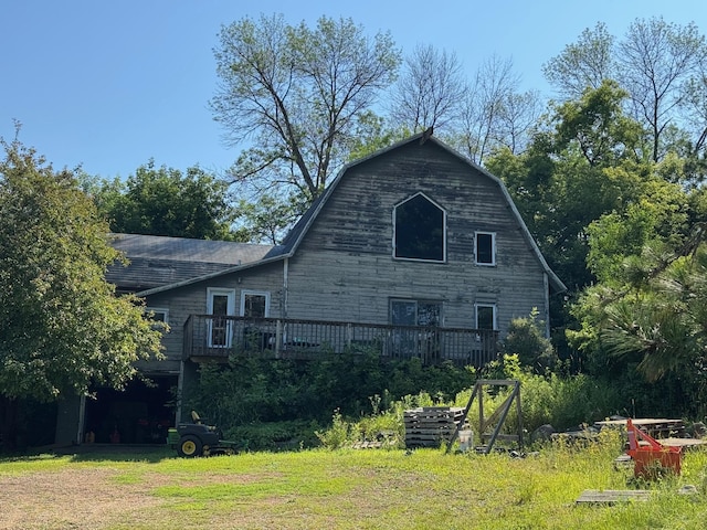 940 Brown Rd S, Wayzata, MN 55391 - back of house with a deck and a gambrel roof
