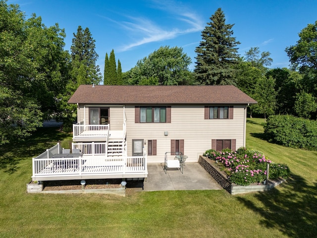 350 3rd St NE, Mcintosh, MN 56556 - rear view of property featuring a patio area, a deck, and a lawn