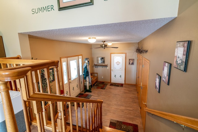350 3rd St NE, Mcintosh, MN 56556 - foyer entrance with a textured ceiling, wood finished floors, ceiling fan, and french doors