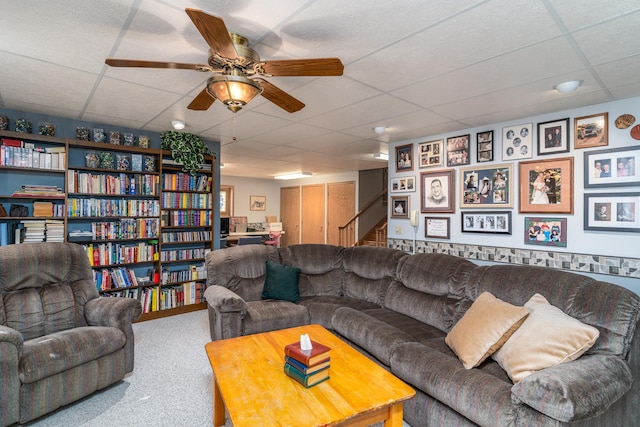 350 3rd St NE, Mcintosh, MN 56556 - living room with a paneled ceiling, stairway, carpet floors, and a ceiling fan