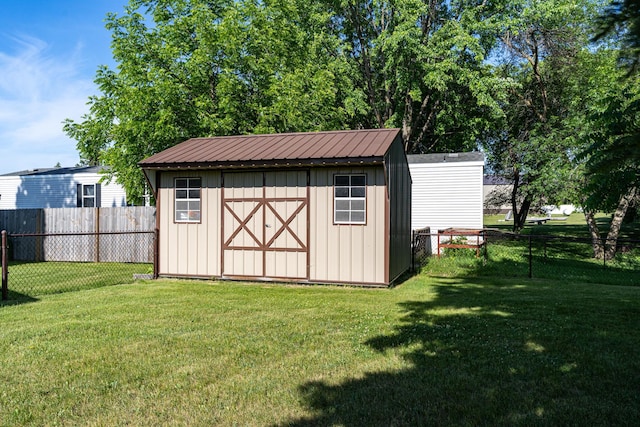 350 3rd St NE, Mcintosh, MN 56556 - view of shed featuring a fenced backyard