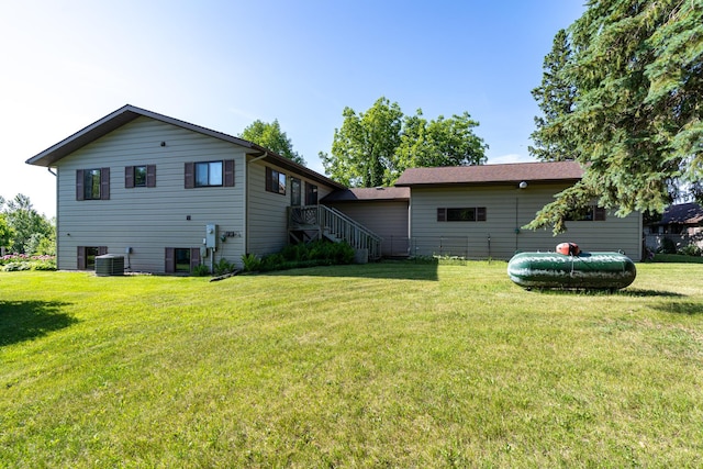 350 3rd St NE, Mcintosh, MN 56556 - back of house featuring a yard and stairs