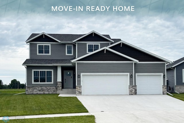 1449 66th Ave S, Fargo, ND 58104 - craftsman inspired home with concrete driveway, a front yard, stone siding, a garage, and a shingled roof
