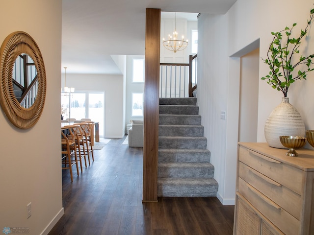 1449 66th Ave S, Fargo, ND 58104 - stairs featuring a chandelier and wood finished floors
