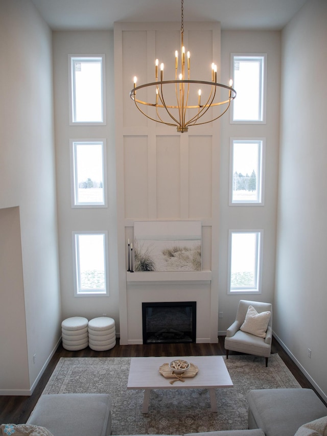 1449 66th Ave S, Fargo, ND 58104 - living area with a chandelier, healthy amount of natural light, and a glass covered fireplace