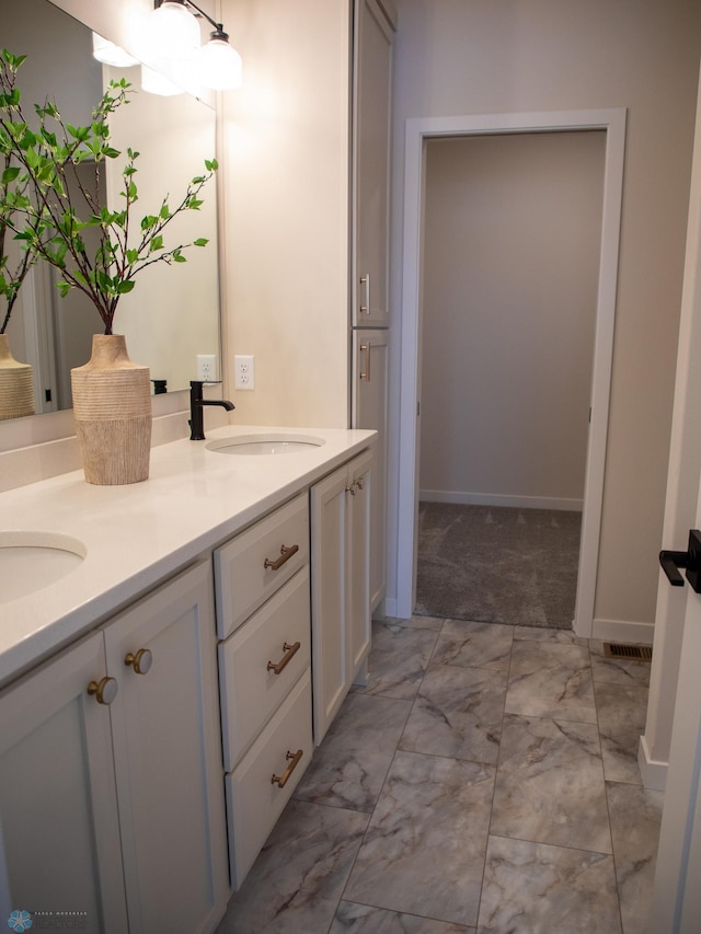 1449 66th Ave S, Fargo, ND 58104 - full bathroom with marble look tiles and double vanity