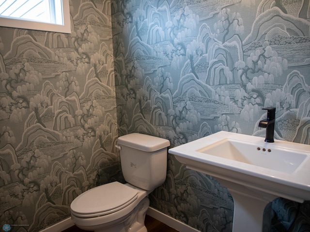 1449 66th Ave S, Fargo, ND 58104 - half bath featuring toilet and a sink