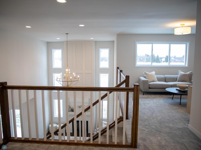 1449 66th Ave S, Fargo, ND 58104 - stairway featuring carpet, a chandelier, healthy amount of natural light, and recessed lighting