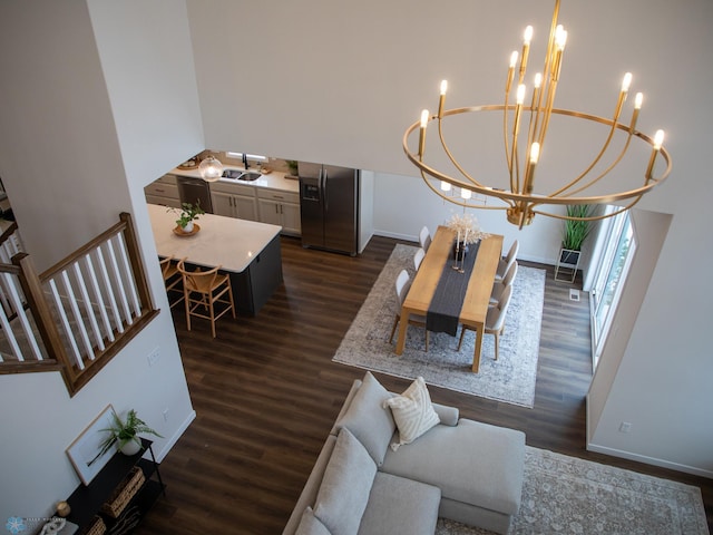 1449 66th Ave S, Fargo, ND 58104 - living room with a chandelier and dark wood-style floors