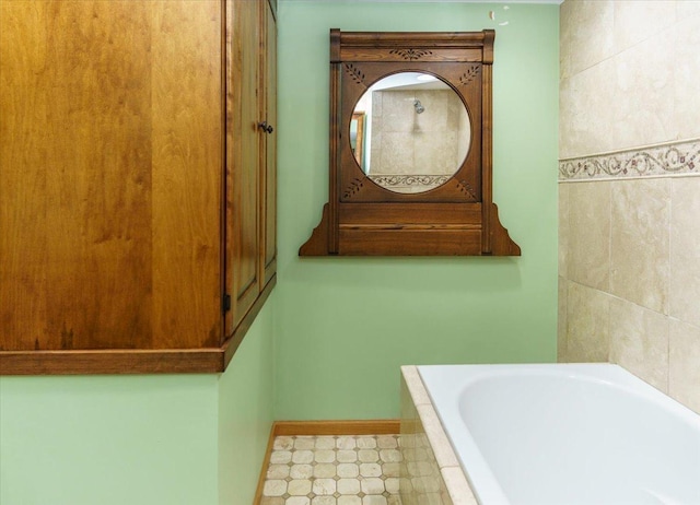 8335 Bush Lake Rd, Bloomington, MN 55438 - bathroom featuring a relaxing tiled tub and baseboards