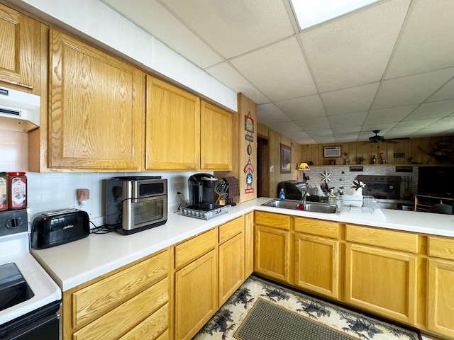 1198 Mink Rd, Ellsburg Twp, MN 55724 - kitchen with stove, a paneled ceiling, backsplash, range hood, and light countertops