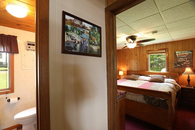 1198 Mink Rd, Ellsburg Twp, MN 55724 - bedroom with wood walls and ensuite bath