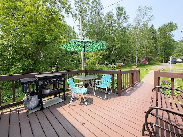 1198 Mink Rd, Ellsburg Twp, MN 55724 - deck featuring area for grilling and view of wooded area