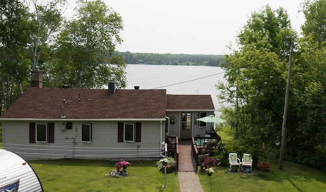 1198 Mink Rd, Ellsburg Twp, MN 55724 - rear view of property with a chimney, a lawn, a shingled roof, and a deck with water view