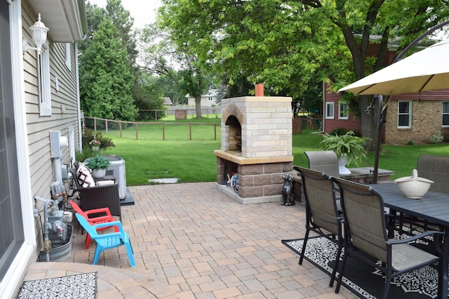 12115 50th Ave N, Plymouth, MN 55442 - view of patio with an outdoor brick fireplace and outdoor dining space