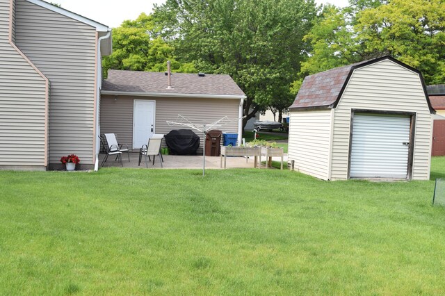 12115 50th Ave N, Plymouth, MN 55442 - view of green lawn with a patio and a storage unit