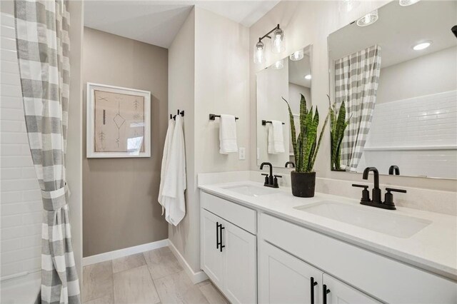 10391 Glacier Ln N, Maple Grove, MN 55369 - bathroom with double vanity and baseboards
