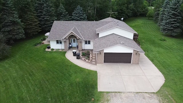 6257 185th Ave SE, Santiago Twp, MN 55308 - view of front of house with concrete driveway, a front yard, a shingled roof, and an attached garage