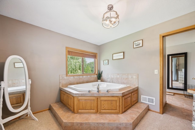 6257 185th Ave SE, Santiago Twp, MN 55308 - bathroom with a bath and a chandelier