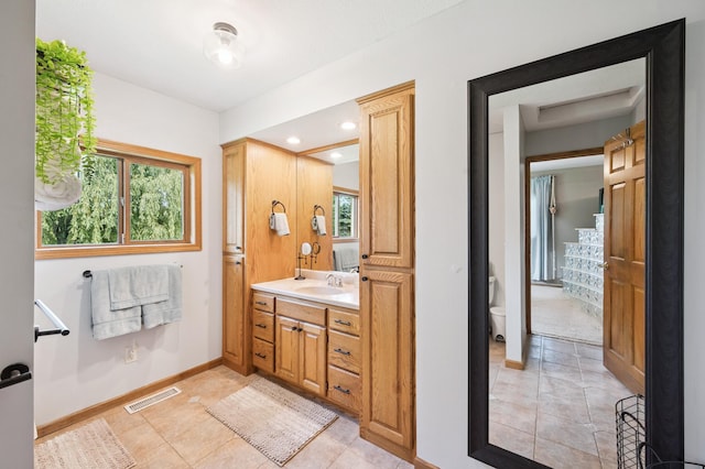 6257 185th Ave SE, Santiago Twp, MN 55308 - bathroom featuring vanity, tile patterned flooring, and recessed lighting