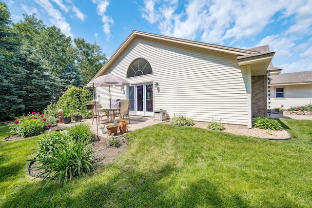 6257 185th Ave SE, Santiago Twp, MN 55308 - back of house with a yard, a patio, and french doors