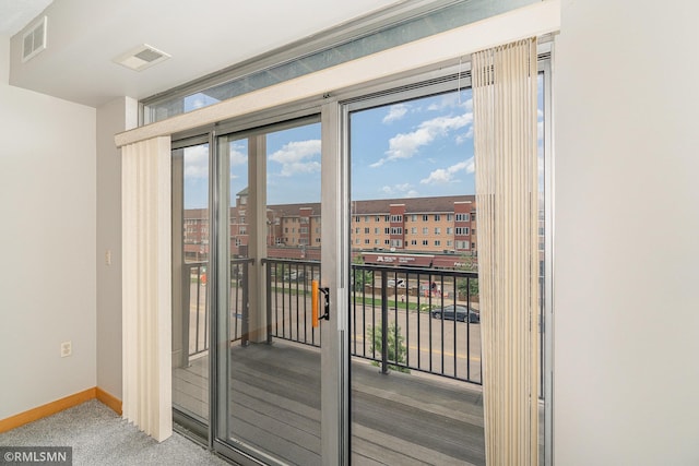 2600 University Ave SE Unit 318, Minneapolis, MN 55414 - doorway featuring baseboards and carpet