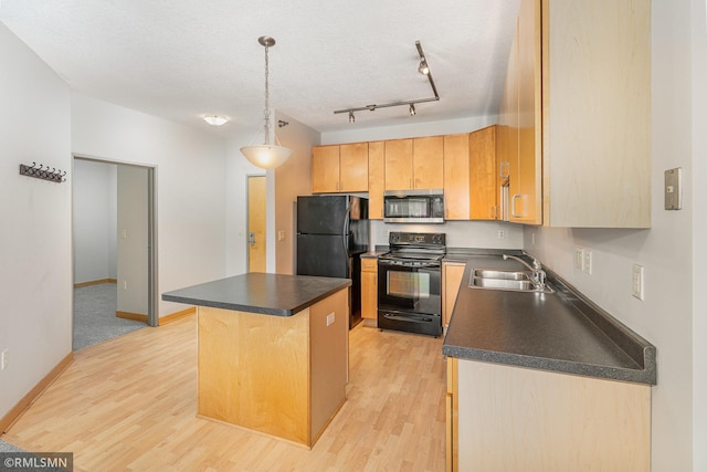 2600 University Ave SE Unit 318, Minneapolis, MN 55414 - kitchen with black appliances, dark countertops, light wood-style floors, and a kitchen island