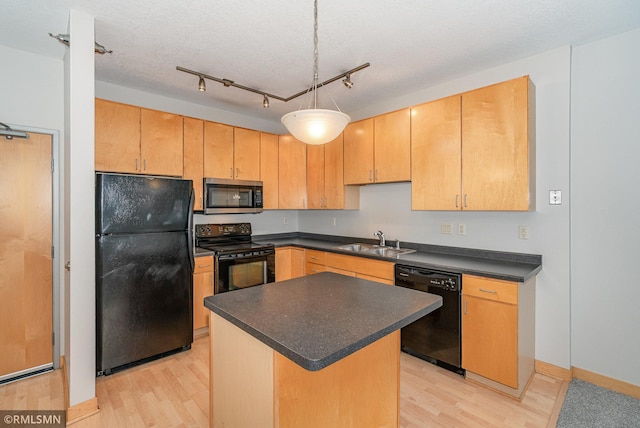 2600 University Ave SE Unit 318, Minneapolis, MN 55414 - kitchen featuring black appliances, light wood finished floors, dark countertops, and a kitchen island