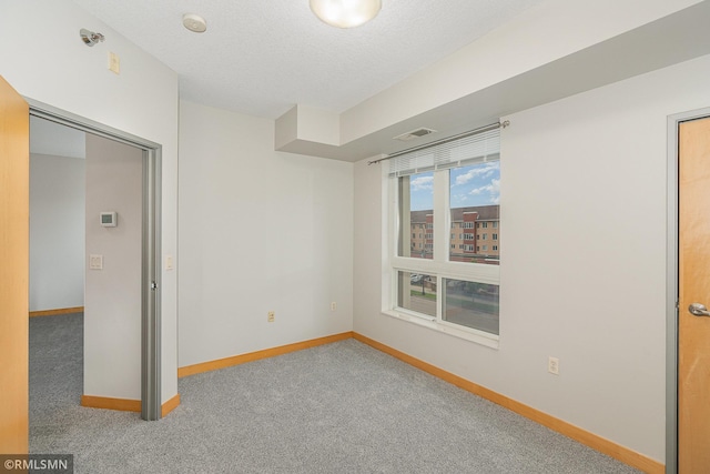 2600 University Ave SE Unit 318, Minneapolis, MN 55414 - unfurnished bedroom featuring baseboards and carpet