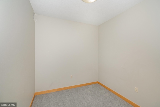 2600 University Ave SE Unit 318, Minneapolis, MN 55414 - unfurnished room featuring carpet and baseboards