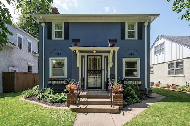1407 Pascal St N, Saint Paul, MN 55108 - view of front of house with a chimney and stucco siding
