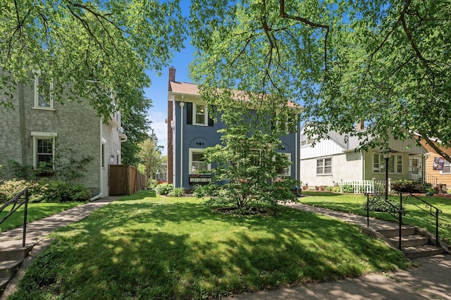 1407 Pascal St N, Saint Paul, MN 55108 - view of front facade featuring stucco siding and a chimney