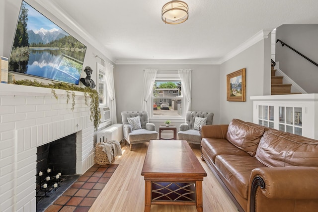 1407 Pascal St N, Saint Paul, MN 55108 - living area featuring a fireplace, ornamental molding, wood finished floors, and stairway