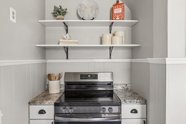 1407 Pascal St N, Saint Paul, MN 55108 - kitchen featuring open shelves, stainless steel range with electric stovetop, light stone countertops, and white cabinetry