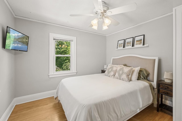 1407 Pascal St N, Saint Paul, MN 55108 - bedroom with wood finished floors, crown molding, and ceiling fan